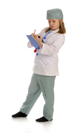 young girl dressed up like a doctor or surgeon with reflection on white backgroundの写真素材