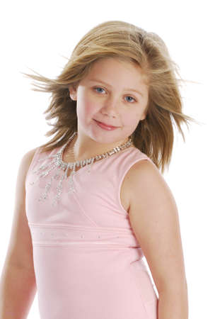 pretty little girl dressed in pink on white backgroundの写真素材