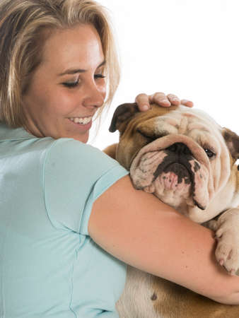 woman holding her dog - english bulldogの写真素材