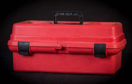 red tool box on black backgroundの写真素材