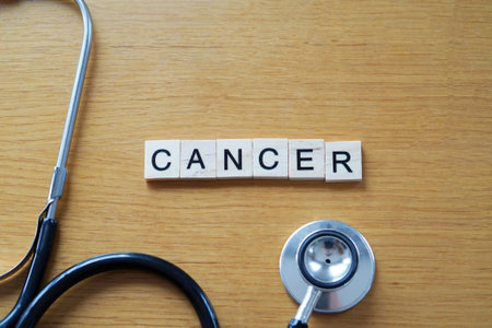 cancer. stethoscope and wooden letters. health and medicine conceptの写真素材