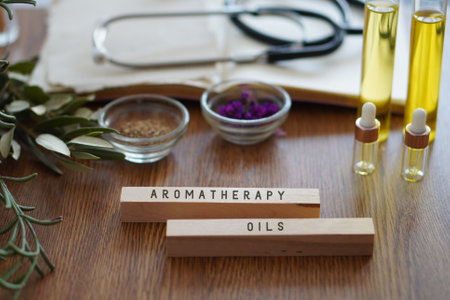 aromatherapy oils. table with stethoscope, oils and natural remediesの写真素材