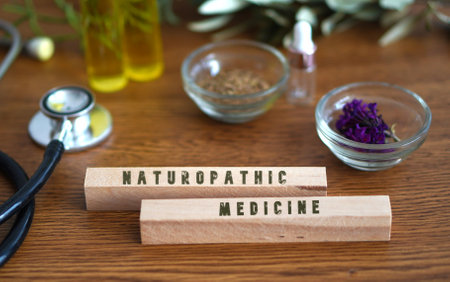 NATUROPATHIC MEDICINE. table with stethoscope, oils and natural remedies.の写真素材