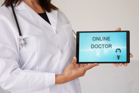 Online doctor. female doctor with stethoscope and telehealth application on a tabletの写真素材
