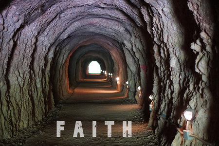 faith concept. word written in a tunnel with light at the end, at the exit.