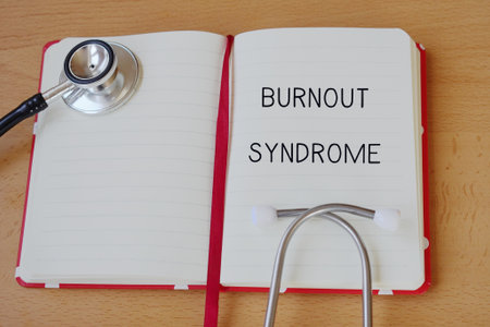 medical terms. burnout syndrome. Words written with a stethoscope in a medical notebook.の写真素材