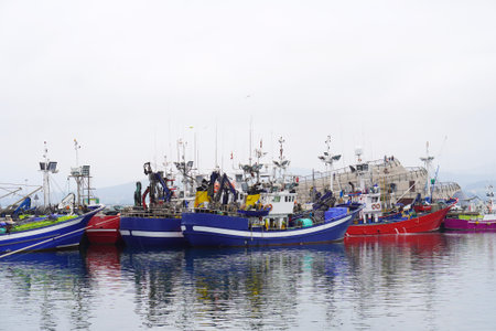 fishing boats in the port of a fishing village in the cantabrian sea.の写真素材