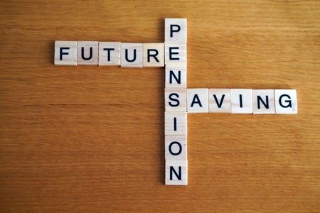 future, pension, and savings. financial concepts. words written in wooden letters like a crossword...