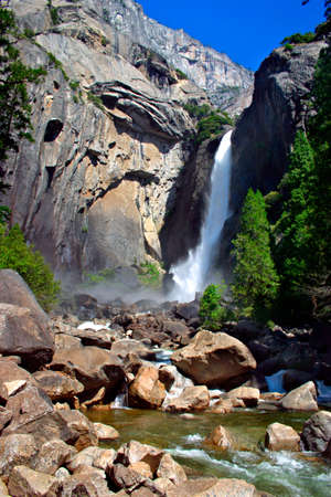 Yosemite Falls is the highest measured waterfall in North America. Located in Yosemite National Park in the Sierra Nevada mountains of California, it is a major attraction in the park, especially in late spring when the water flow is at its peak.の写真素材
