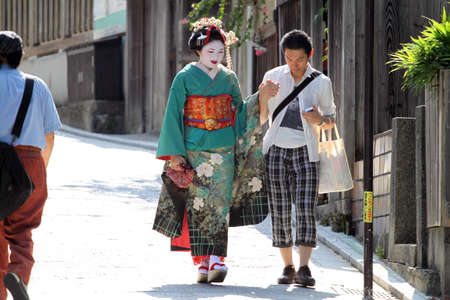 Maiko walking on a street (Kyoto, Japan) 
のeditorial素材