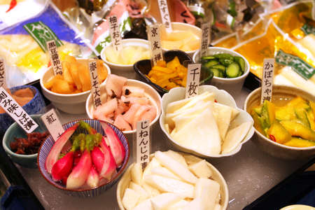 Nishiki Market is a narrow, shopping street, lined by more than one hundred shops. Various kinds of fresh and processed foods including many Kyoto specialties, such as pickles, Japanese sweets, dried food, sushi, and fresh seafood and vegetables are sold.のeditorial素材