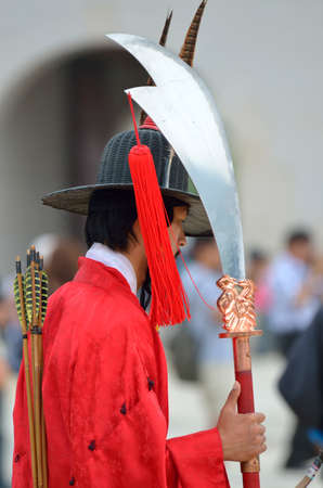Row of armed guards in ancient traditional soldier uniforms in the old royal residence, Seoul, South...