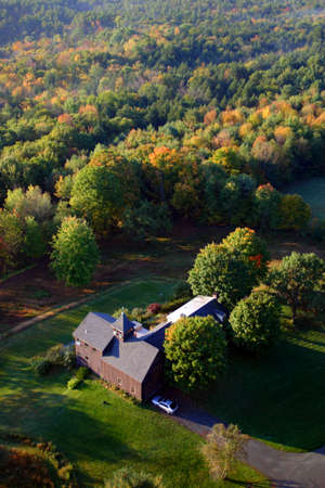 An aerial view of a hot air balloon floating over the Vermont country side 
のeditorial素材