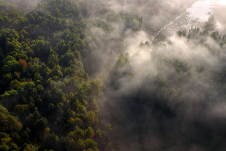 An aerial view of a hot air balloon floating over the Vermont country side 
の写真素材