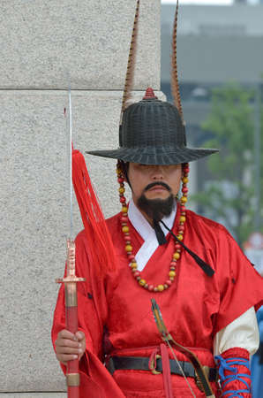 Row of armed guards in ancient traditional soldier uniforms in the old royal residence, Seoul, South...