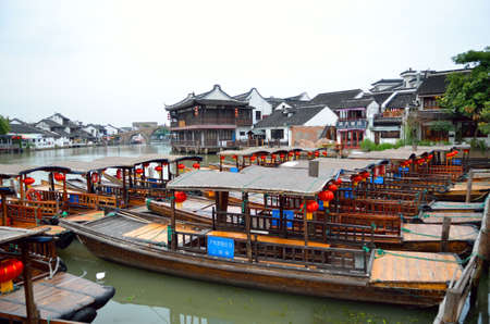 Old village by river in Shanghai with boatのeditorial素材