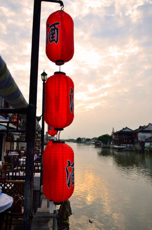 Old village by river in Shanghai with boatのeditorial素材