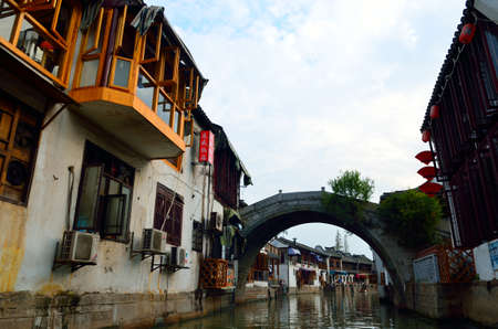 Old village by river in Shanghai with boatのeditorial素材