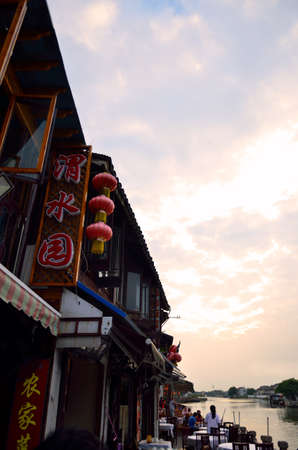 Old village by river in Shanghai with boatのeditorial素材