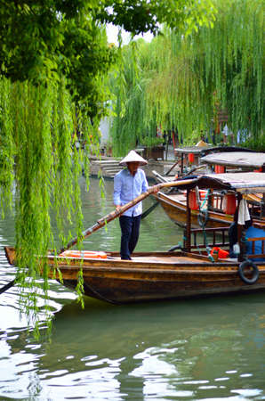 Old village by river in Shanghai with boatのeditorial素材