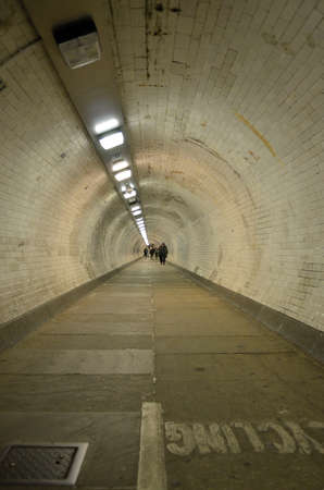 The Greenwich Foot Tunnel crosses beneath the River Thames in East London, linking Greenwich in the south with the Isle of Dogs to the northのeditorial素材