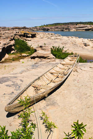 Old boat on the sand in northeast Thailandの写真素材
