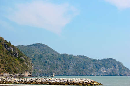 Jetty,sea,mountain and blue skyの写真素材