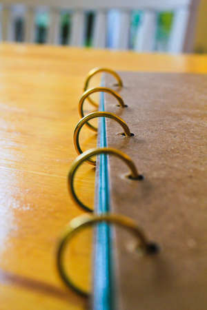 Golden ring at the spine of brown bookの写真素材