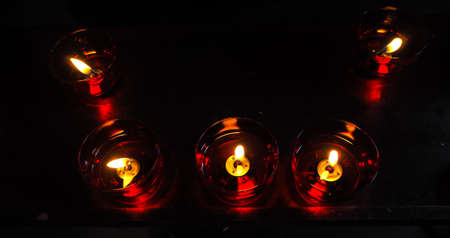 Living light candles in churchの写真素材