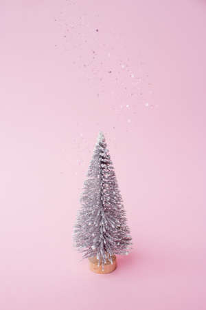 green Christmas tree on a pink backgroundの写真素材