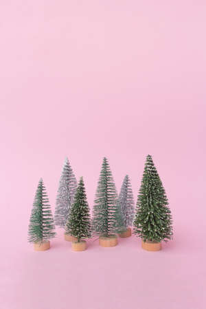 green Christmas tree on a pink background