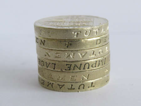 Small stack of UK one pound coinsの写真素材