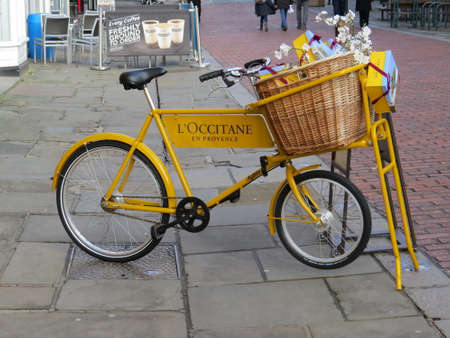 Old fashioned delivery bike used outside a shop to advertise their wares.