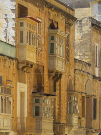 On just about every terraced building in Malta, balconies like these are present.  The walled city of Valletta has thousands of them.の写真素材