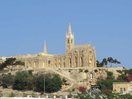 Our Lady of Lourdes church overlooks the ferry terminal on the Maltese island of Gozo.の写真素材