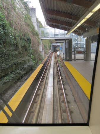 View of the track as seen from the front window of one of Vancouvers Sky Train carriages.