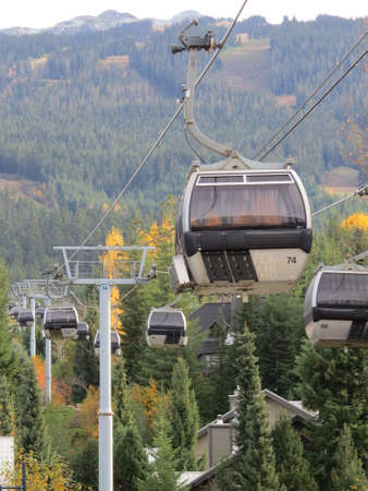 Gondolas which takes skiers up the ski slopes in Whistler, Canada during the Winter and walkers to the top in the Summer months.のeditorial素材