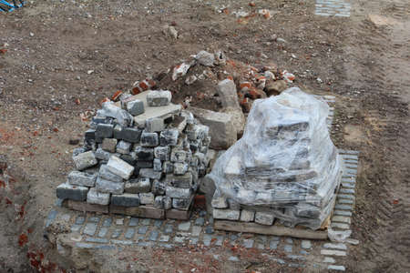 Used cobblestones stacked on a pallet ready to be recycled.