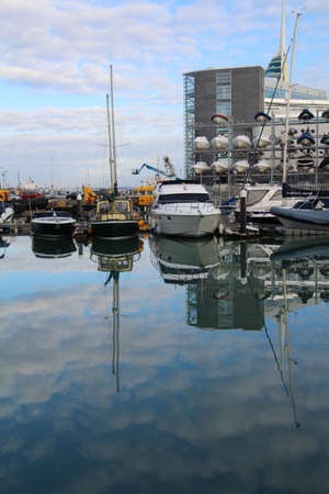 Boats reflecting in the still waters of Camber docks in Old Portsmouth.のeditorial素材