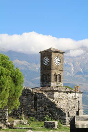 Old clock tower above the Albanian town of Gjirokastra.の写真素材