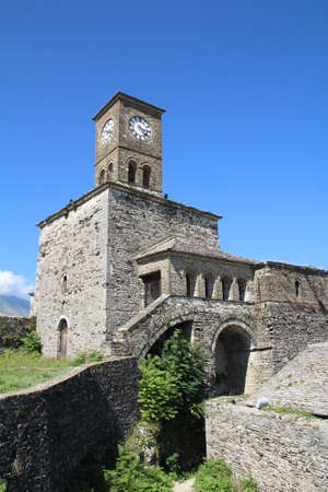 Old clock tower above the Albanian town of Gjirokastra.の写真素材