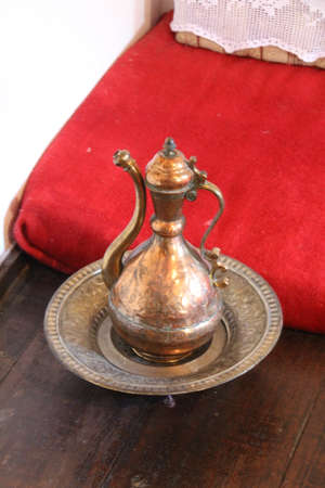 Ornate water jug and bowl in an Albanian home.の写真素材