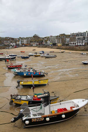 Boats on the sands of St Ives harbour when the tide is out.