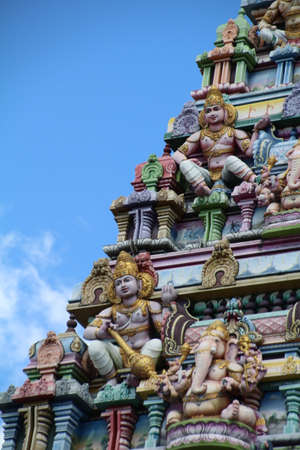 Part of the ornate exterior of the Arul Mihu Navasakthi Vinayagar Hindu temple in Victoria on Mahe island in the Seychelles.の写真素材