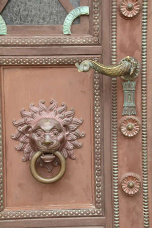 Door furniture on the main door to the cathedral in Pecs, Hungary.の写真素材