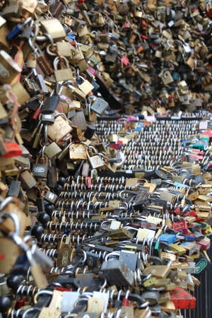 Padlocks attached to railings in Pecs, Hungary. It has become a tradittion to leave a padlock on completion of studies at the local university. They are also left to symbolise commitment to a partner.のeditorial素材