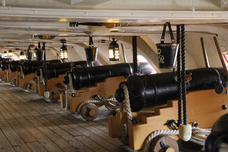 Cannons on one of the gun decks of an old naval vessel.