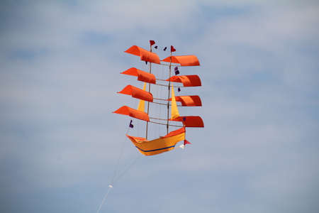 Colourful kite in the shape of an old sailing vessel.の写真素材