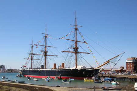 HMS Warrior moored in Portsmouth, England. HMS Warrior with her sister ship HMS Black Prince were the worlds first iron-clad warships.のeditorial素材