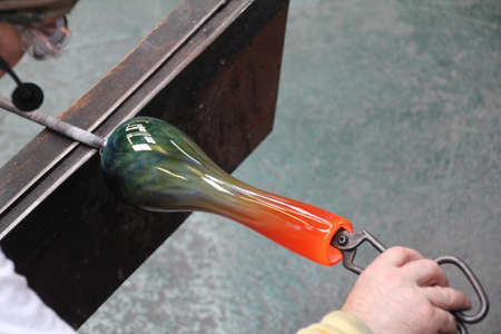 Needles, Isle of Wight - 27 August, 2018: Glassware being made by hand in a glass blowing workshop